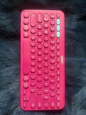 Logitech Pink Wireless Round-Key Keyboard with Light Blue Accents